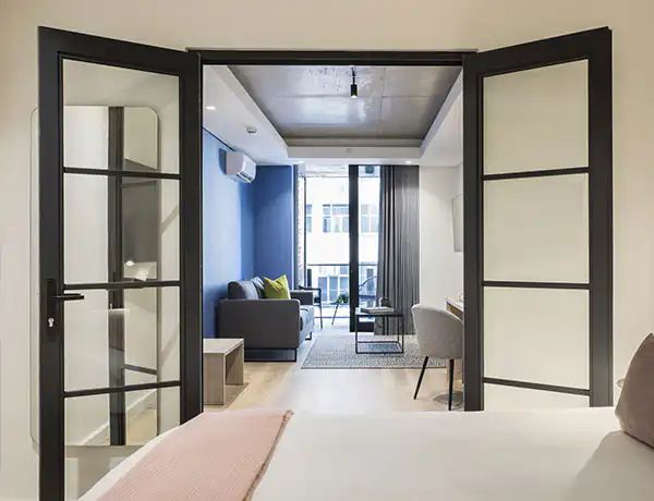 Bedroom and lounge in a Home Superior suite at Station House