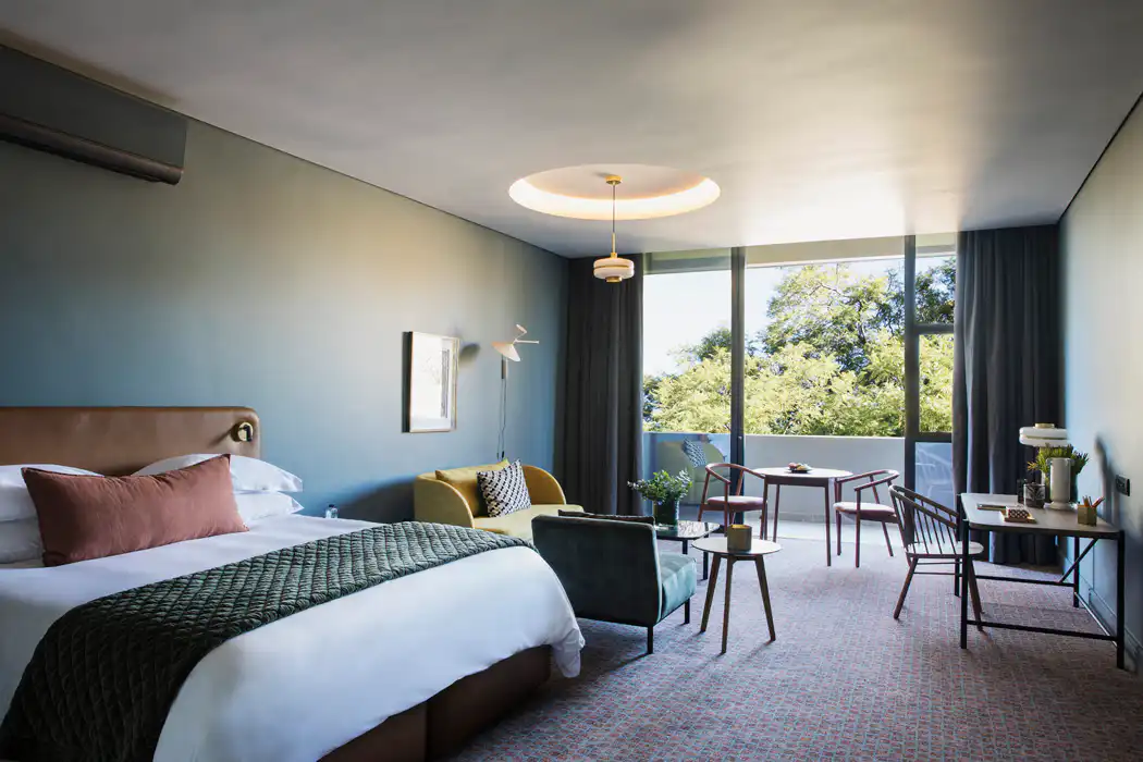 Spacious guest room at Home Suite Hotels Rosebank