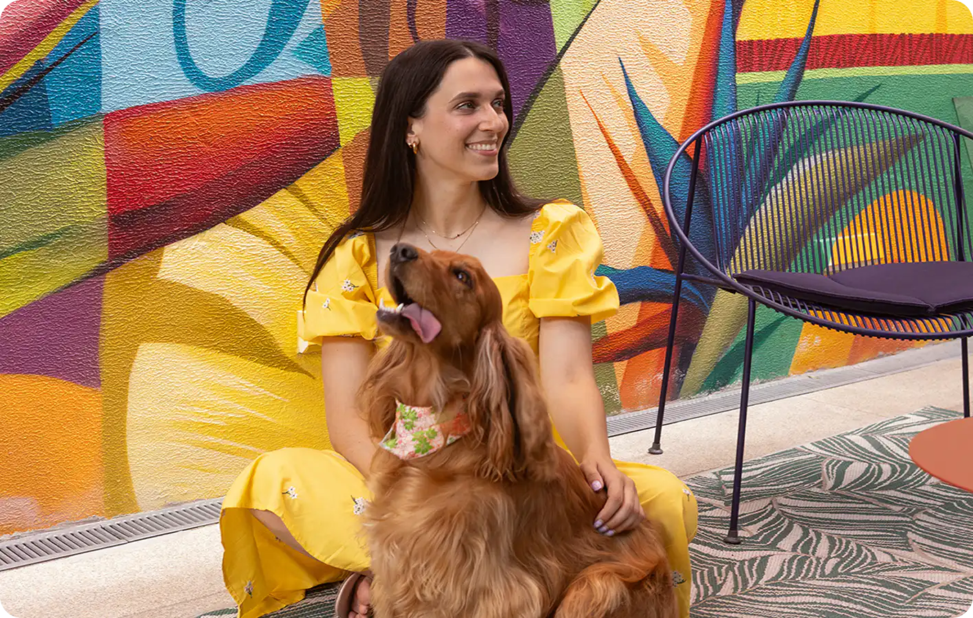 Guest relaxing with her dog at Home Suite Hotels