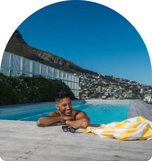 Guest relaxing in the rooftop pool at Station House in Sea Point, Cape Town