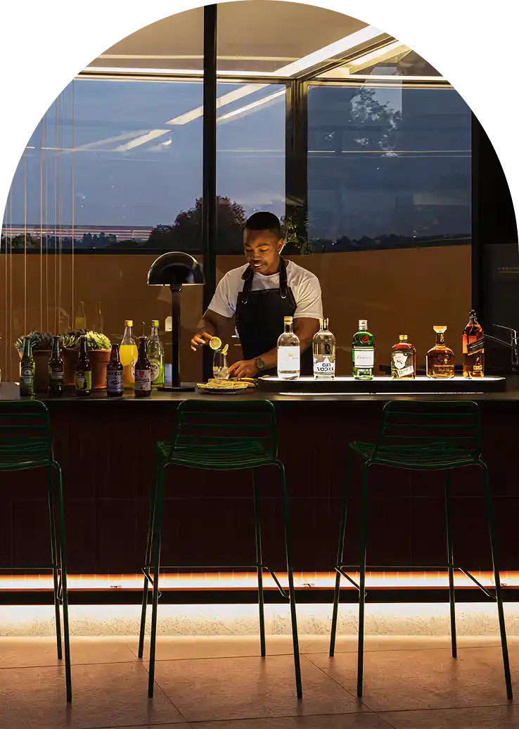Bartender preparing cocktails at Home Suite Hotels Rosebank