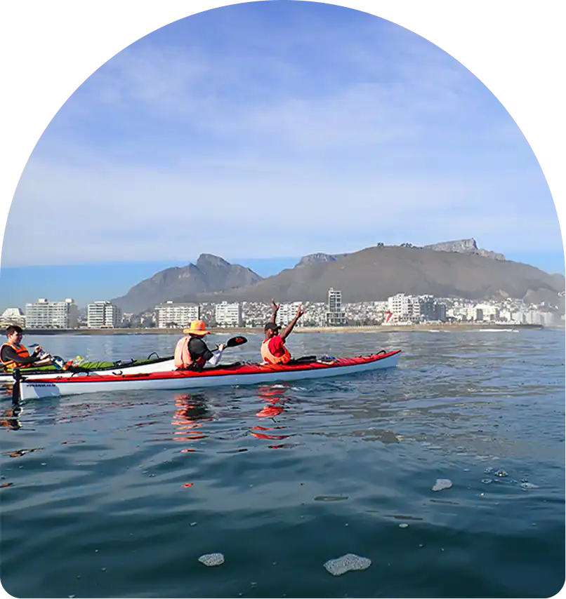Sea kayaking off Sea Point with Table Mountain and the Cape Town coastline, near Home Suite Hotels