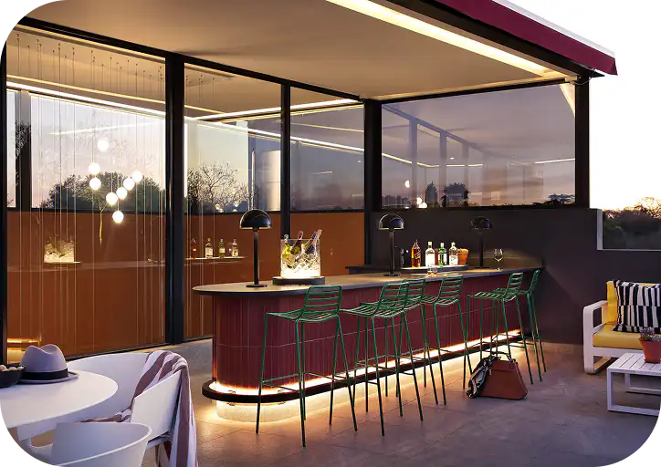 Rooftop bar and lounge at Home Suite Hotels Rosebank at dusk