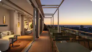 Rooftop terrace at Home Suite Hotels Sea Point at dusk, with lounge seating and views over Cape Town's Atlantic Seaboard